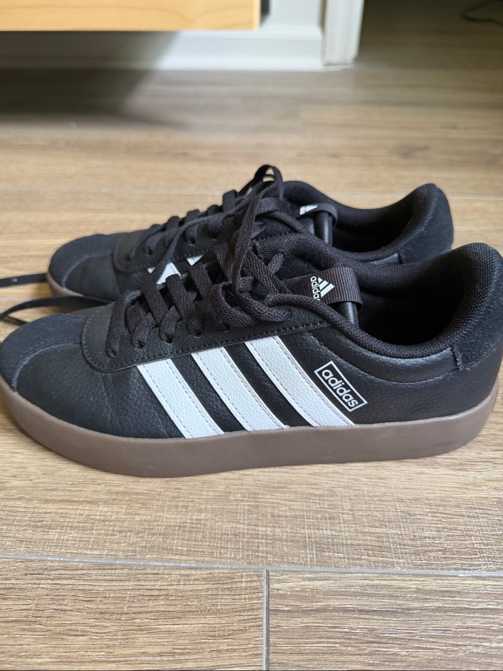 adidas Women’s Black Sneakers with White Stripes and Brown Gum Sole
